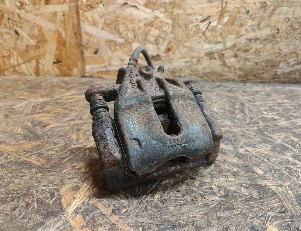 DACIA Logan 2 generation (2013-2020) Zacisk hamulca przedniego prawego 34632032